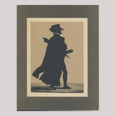 
        Fist pose, with the man who standing, wearing a coat.